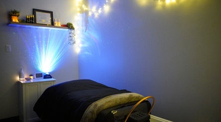 Relaxing spa room at Kawara Head Spa in Ottawa, Ontario, CA with ambient lighting for serene wellness experience.