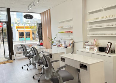 Glossé Nails salon interior with manicure stations and polish display in Vancouver, British Columbia, CA.