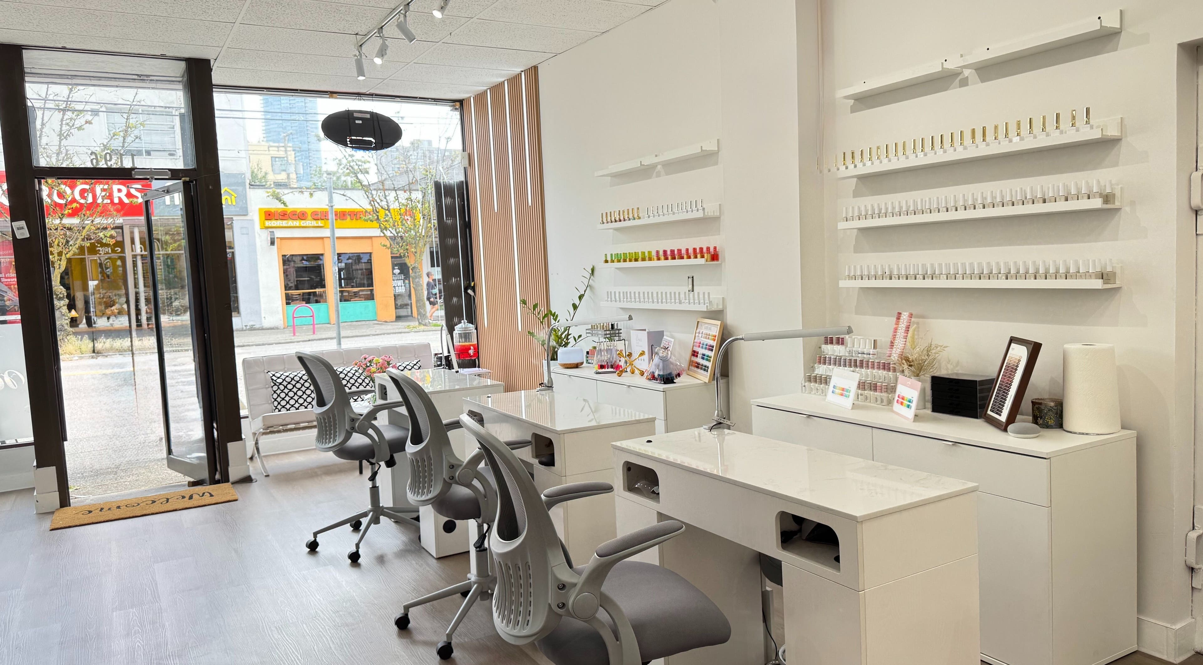 Glossé Nails salon interior with manicure stations and polish display in Vancouver, British Columbia, CA.