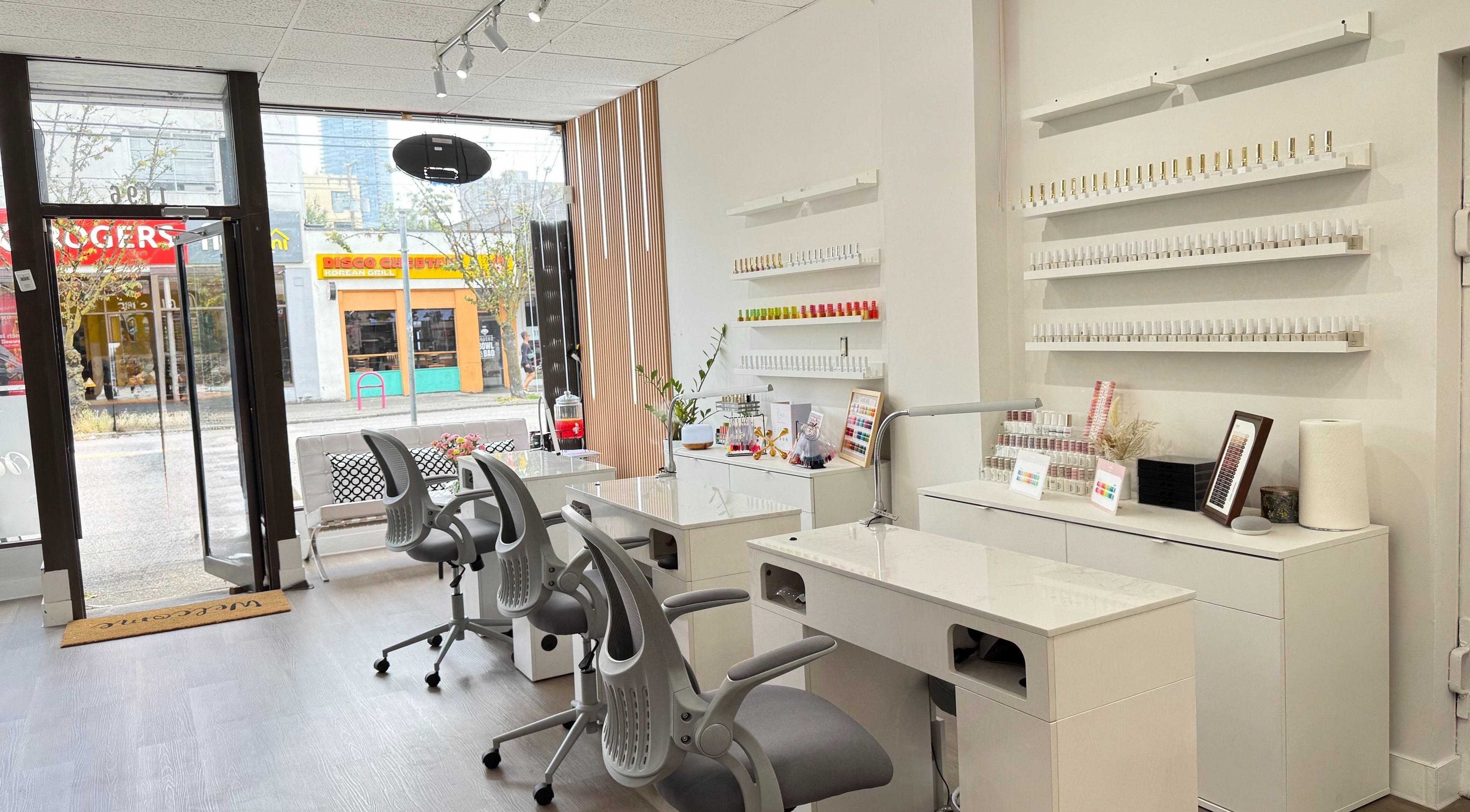 Glossé Nails salon interior with manicure stations and polish display in Vancouver, British Columbia, CA.