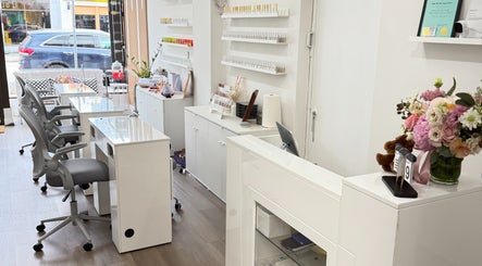 Modern interior of Glossé Nails in Vancouver, British Columbia, CA, featuring chic nail stations and elegant decor.