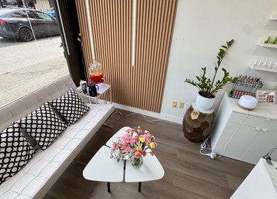 Chic interior of Glossé Nails, Vancouver, British Columbia, CA with cozy seating and elegant decor.