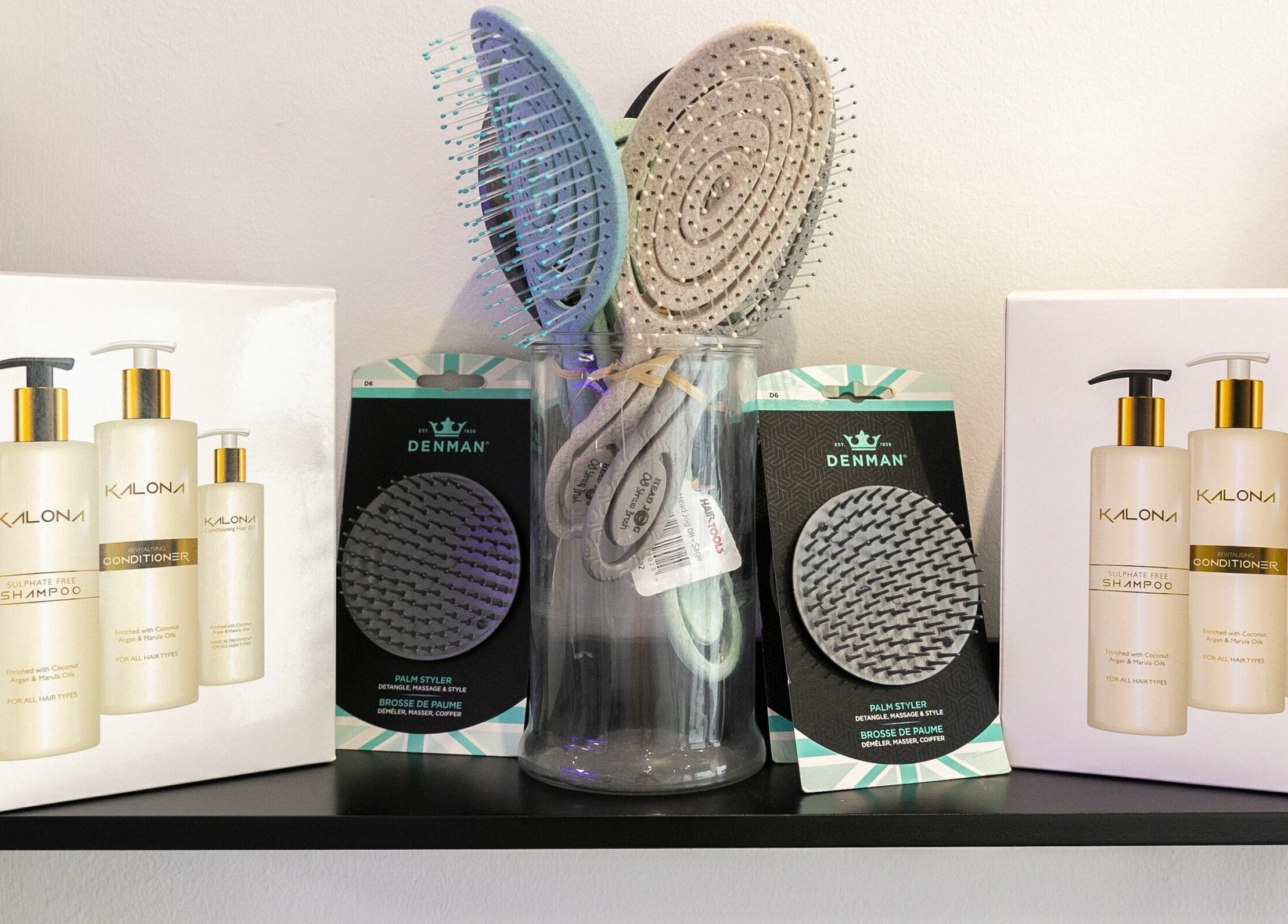 Display of Kalona hair products and Denman brushes at Divas Hair, Cheshunt, England, GB.