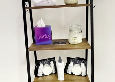 Product display at BeyondLengthEssex, Dunmow, England, GB, showcasing beauty essentials on wooden shelves.