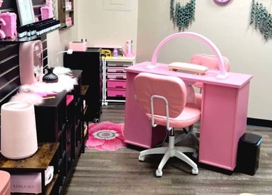 Cozy pink nail station at Mystique Nails in Alpena, Michigan, US with cute decor and modern amenities.