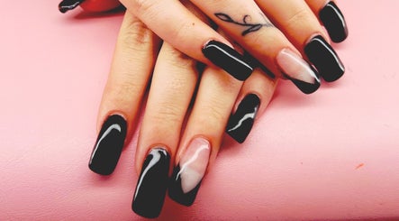 Elegant black and white nails at Mystique Nails, Alpena, Michigan, US. Perfect for chic styles.