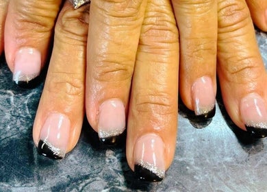 Chic black and silver French manicure at Mystique Nails, Alpena, Michigan, US.