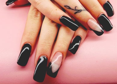 Chic black and white nail art at Mystique Nails, Alpena, Michigan, US. Sleek and stylish manicure design.