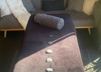 Relaxing massage bed with stones at Mirimiri Mai Rā, Rotorua, Bay Of Plenty Region, NZ.