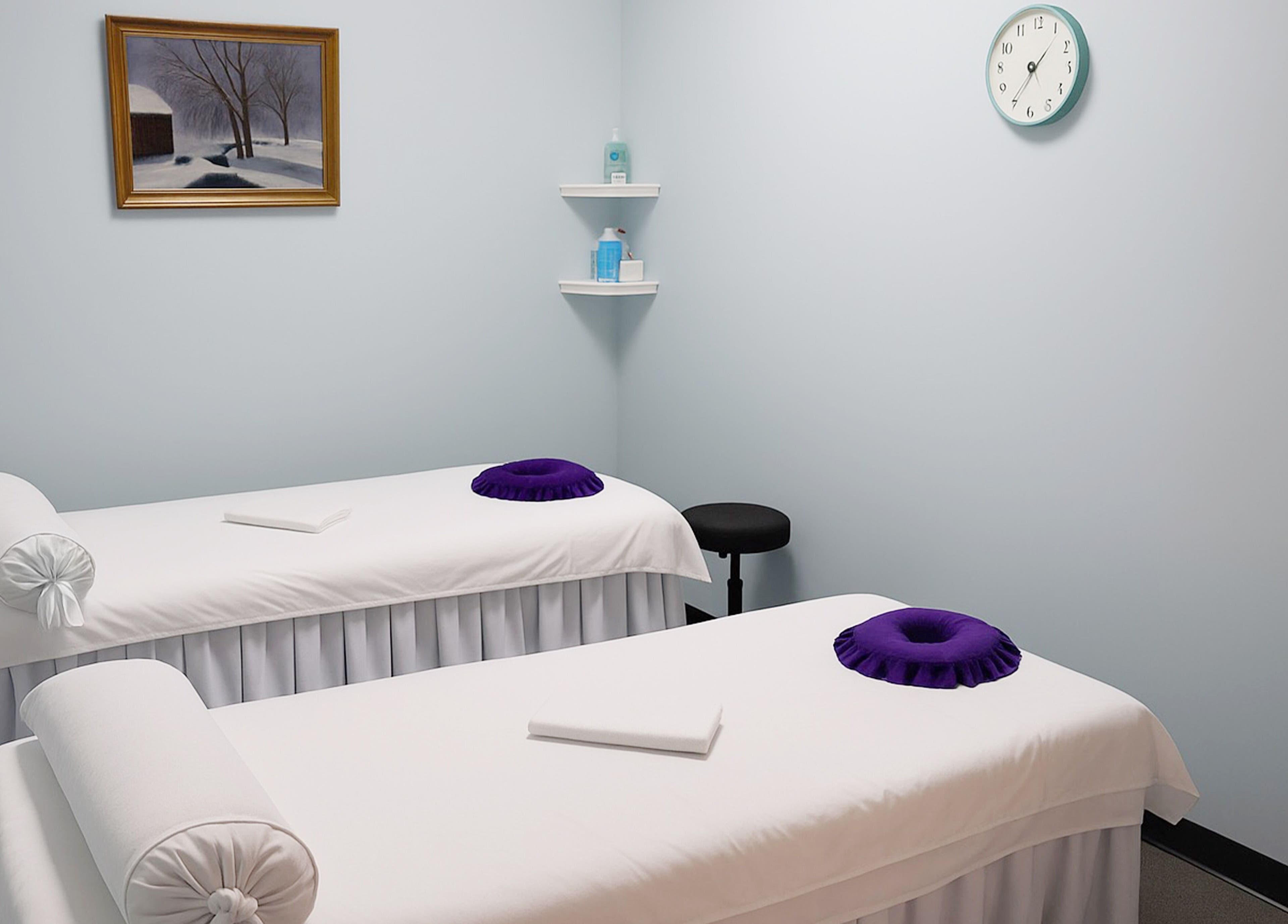 Tranquil massage room at Releaf Massage & Health Spa, Mesa, Arizona, US with dual treatment tables.