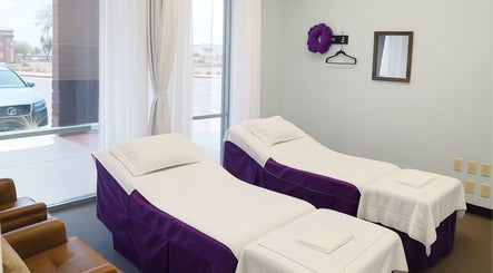 Relaxing massage room at Releaf Massage & Health Spa in Mesa, Arizona, US, with twin massage beds and soft lighting.