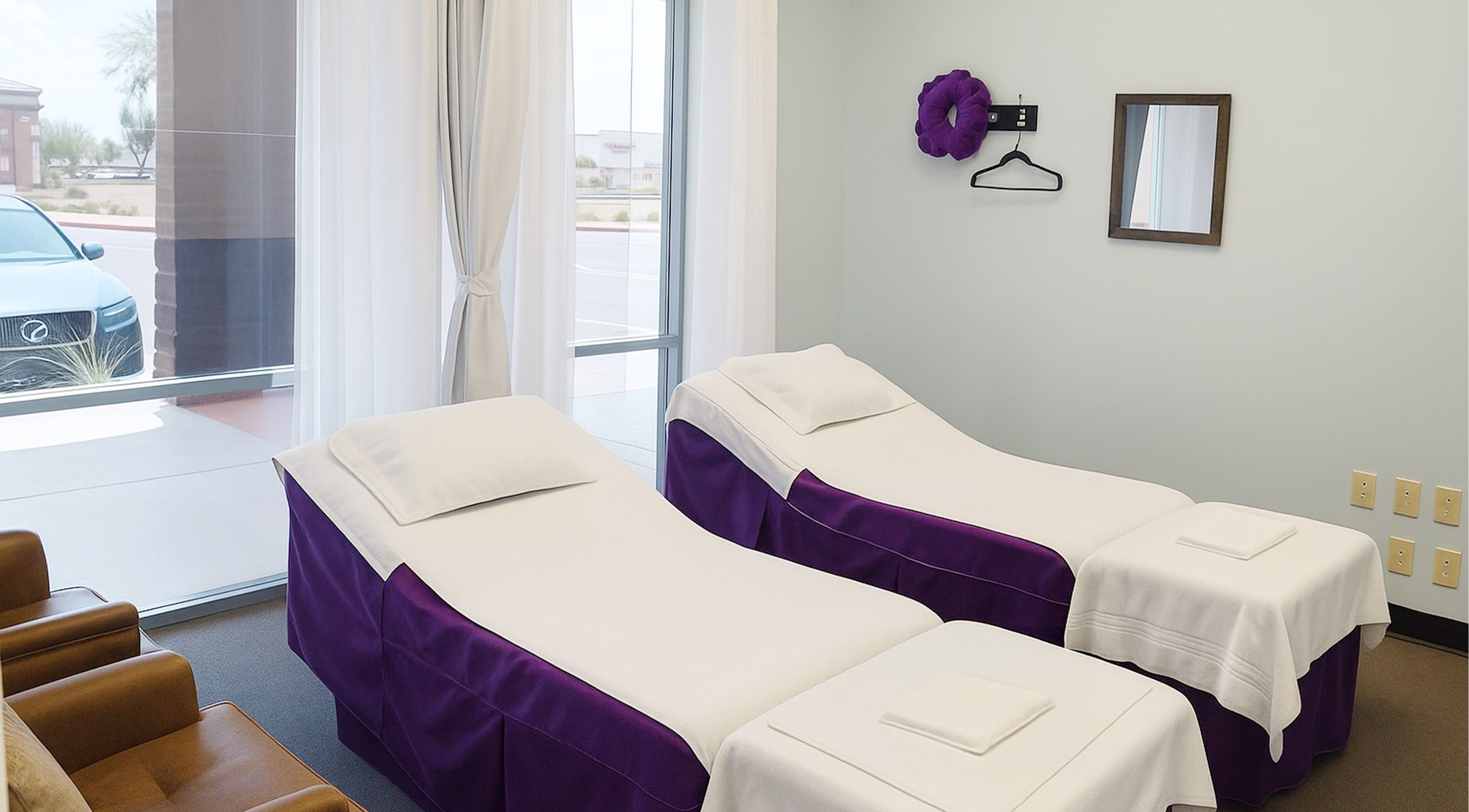 Relaxing massage room at Releaf Massage & Health Spa in Mesa, Arizona, US, with twin massage beds and soft lighting.