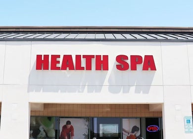 Exterior view of Releaf Massage & Health Spa signage in Mesa, Arizona, US under a clear blue sky.