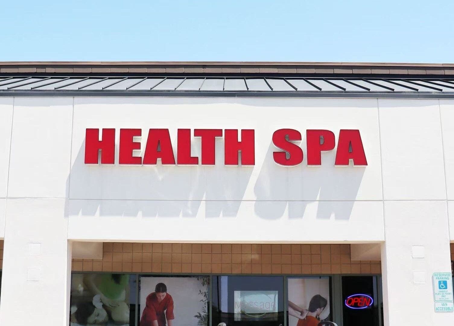 Exterior view of Releaf Massage & Health Spa signage in Mesa, Arizona, US under a clear blue sky.