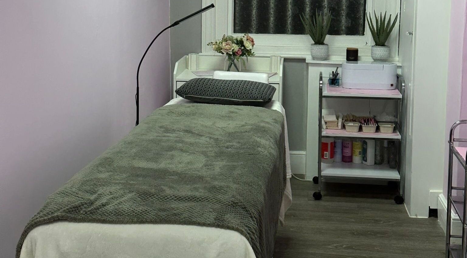 Relaxing treatment room at Beautyhavenbysian, Farnborough, England, GB, ready for a rejuvenating spa experience.