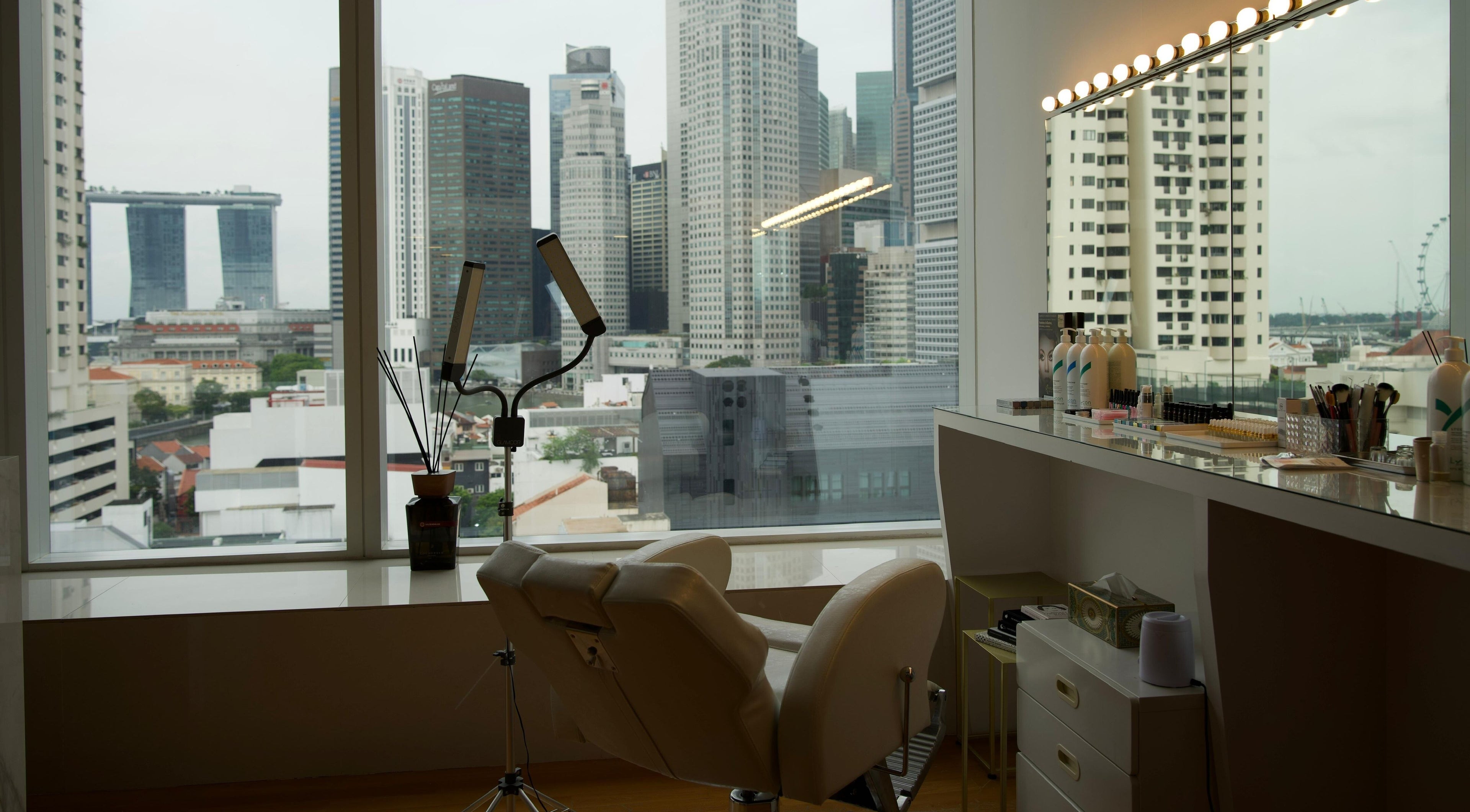Relaxing spa chair at GERGERT BEAUTY PTE LTD, overlooking Singapore skyline, Singapore, SG.