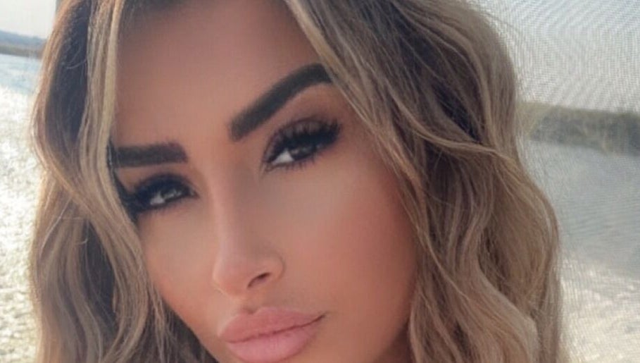 Close-up of styled hair by HairbyStefaniia in Vaughan, Ontario, CA, showcasing beach waves and elegant makeup.