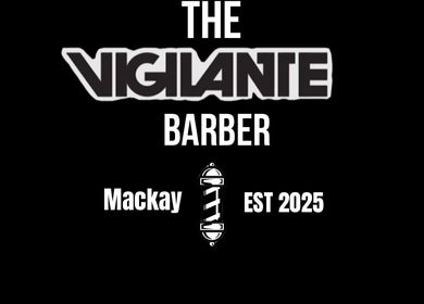 The Vigilante Barber sign at Erakala, Queensland, AU featuring bold black and white design.