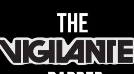 Logo of The Vigilante Barber, Erakala, Queensland, AU in bold typography on a black background.