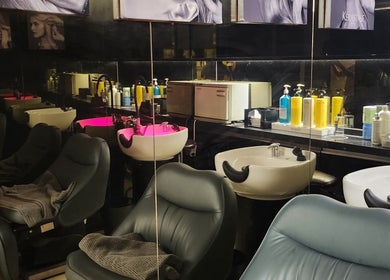 Modern salon area at LeeChul HairKerker Myeongdong 2nd Branch, Seoul, KR with sleek chairs and washing stations.