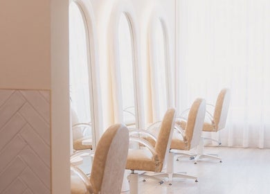 Elegant salon chairs at Goddess Hair Co in Melbourne, Victoria, AU with natural lighting.