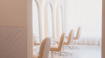 Elegant salon chairs at Goddess Hair Co in Melbourne, Victoria, AU with natural lighting.