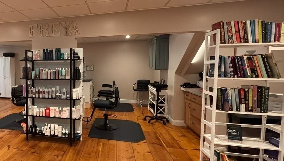 Interior of Freya Beauty Salon in Derry, New Hampshire, US featuring hair products and seating.