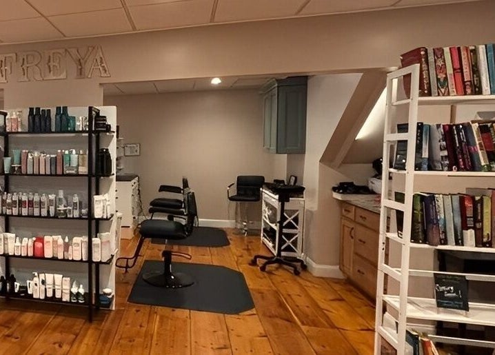 Interior of Freya Beauty Salon in Derry, New Hampshire, US featuring hair products and seating.