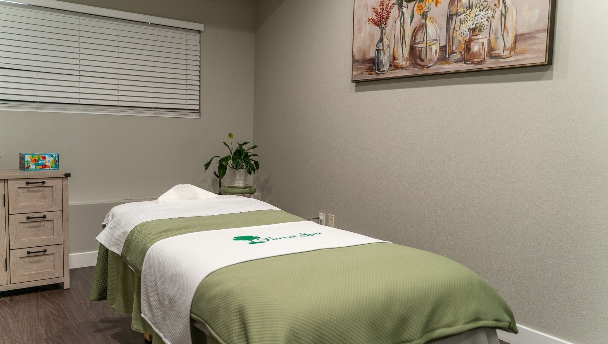 Tranquil massage room at Forest Spa in Poway, California, US with calming decor and soft lighting.