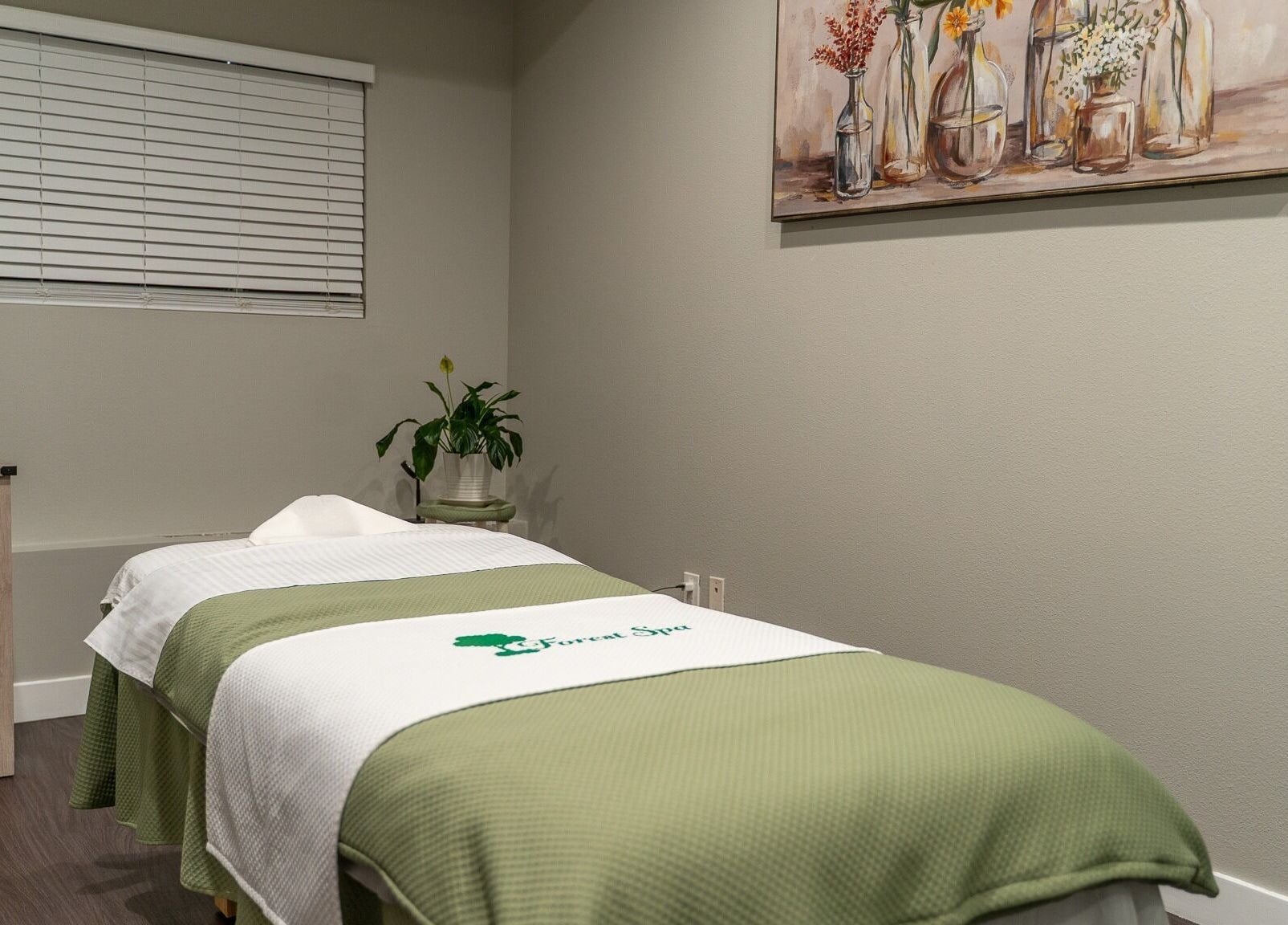 Tranquil massage room at Forest Spa in Poway, California, US with calming decor and soft lighting.
