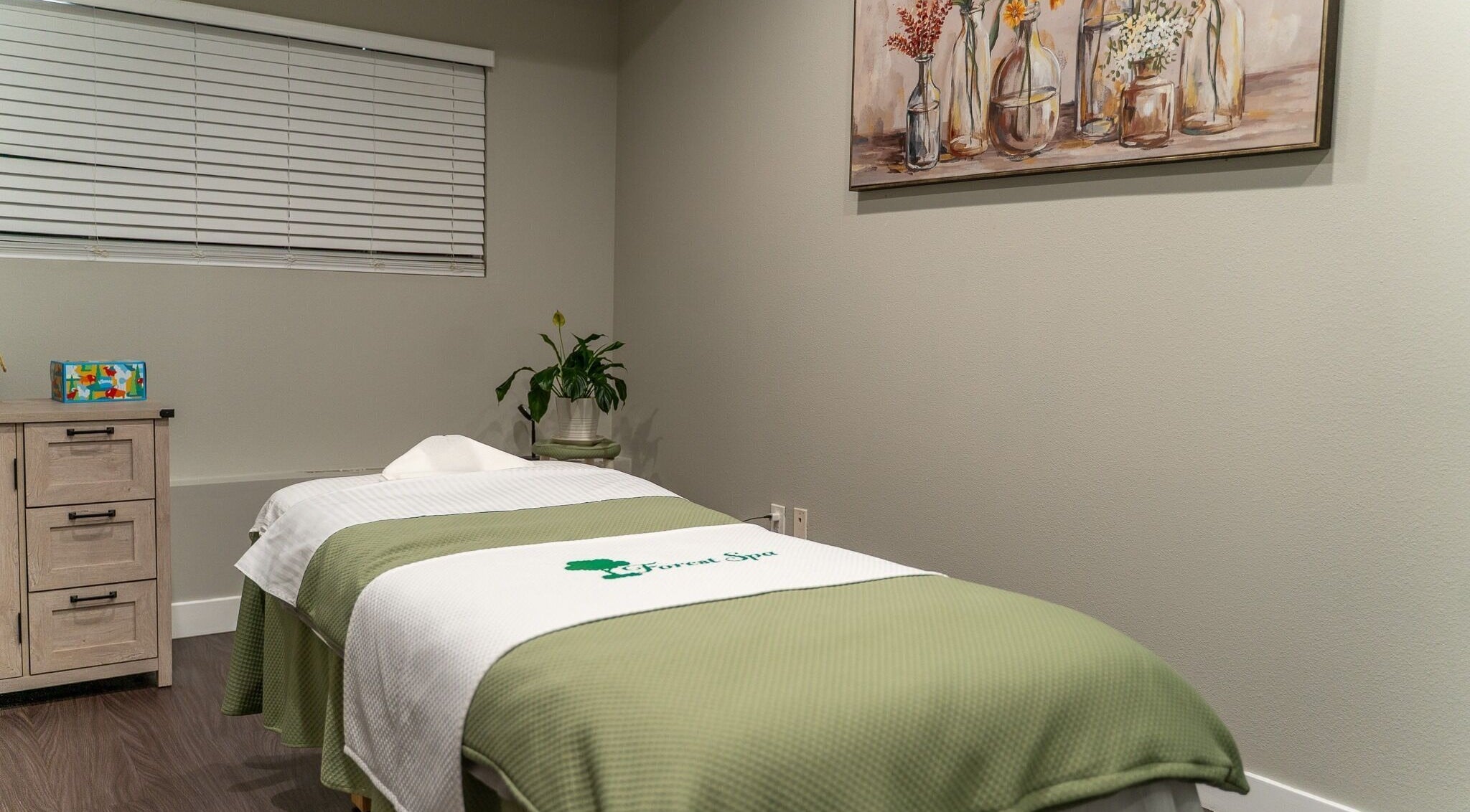 Tranquil massage room at Forest Spa in Poway, California, US with calming decor and soft lighting.
