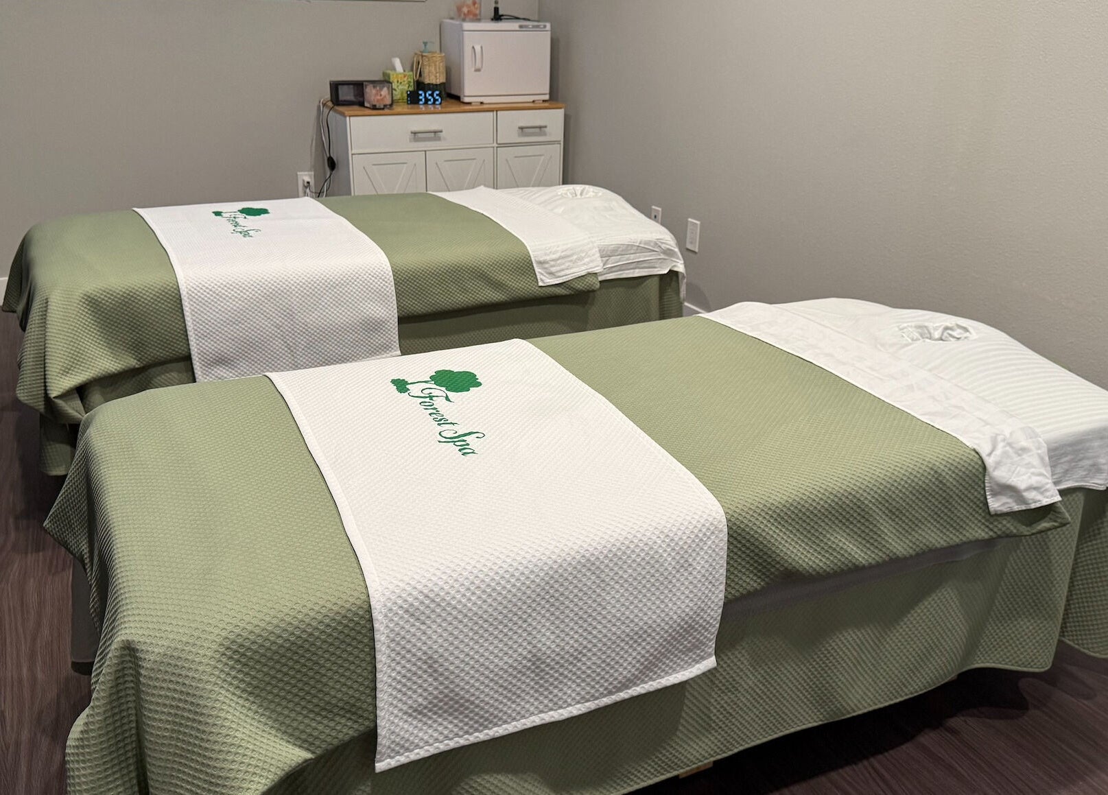 Tranquil massage room with two tables at Forest Spa, Poway, California, US.