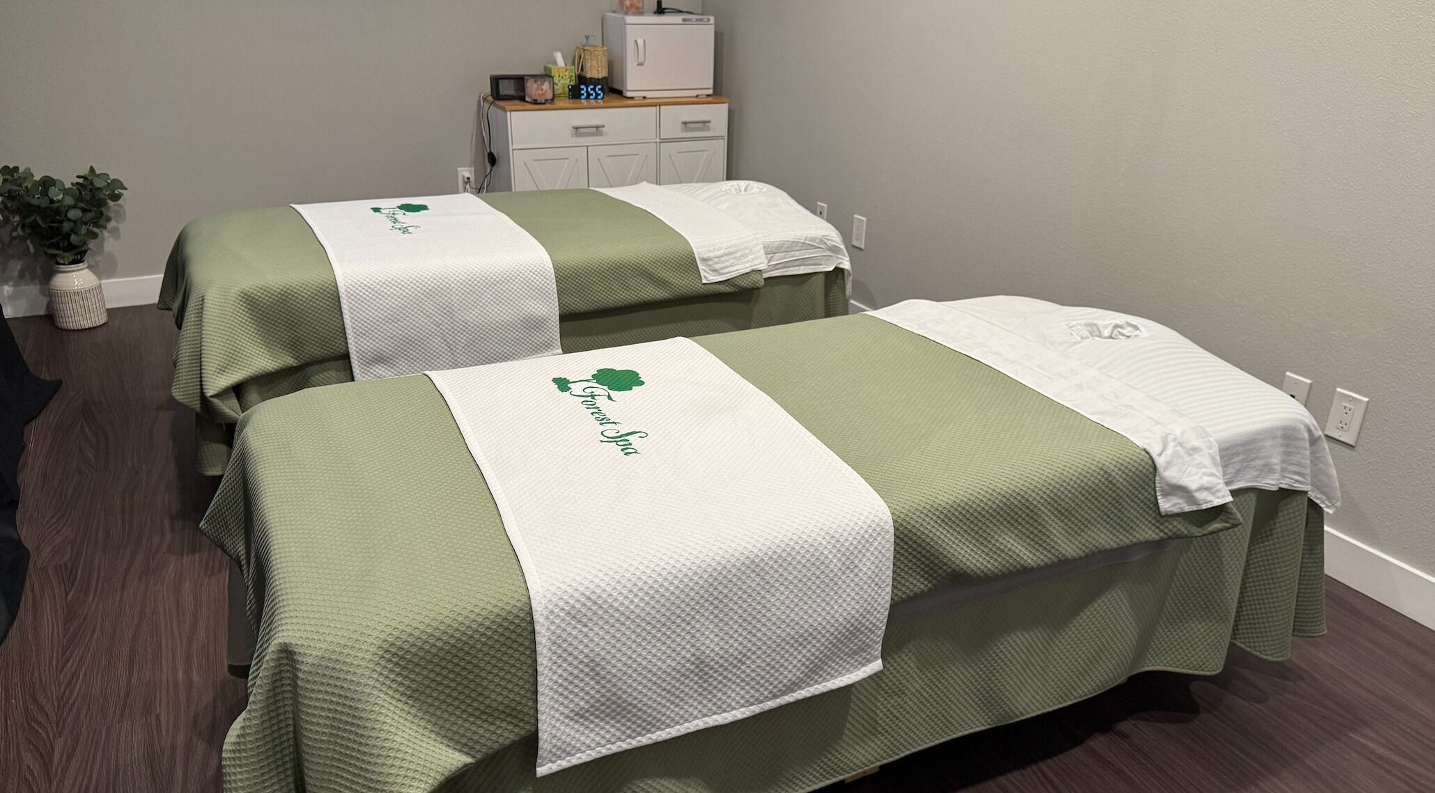 Tranquil massage room with two tables at Forest Spa, Poway, California, US.