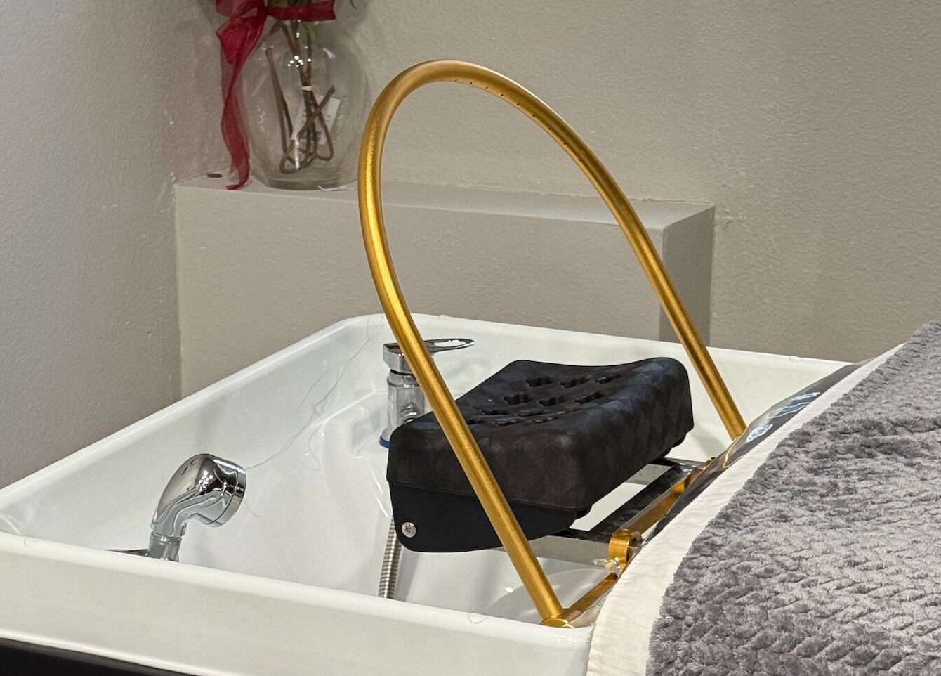 Luxurious pedicure station at Forest Spa, Poway, California, US, featuring plush towel and golden details.