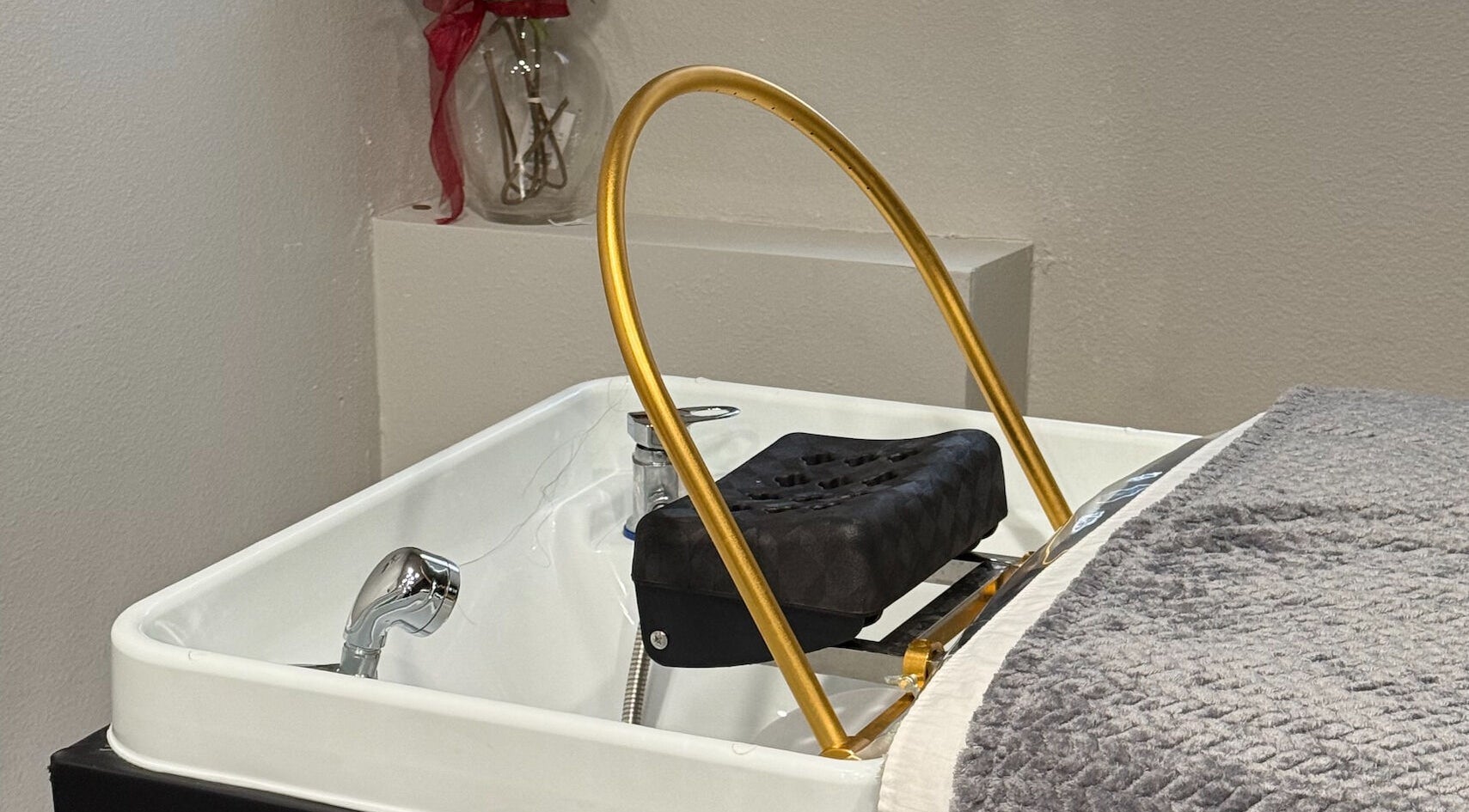 Luxurious pedicure station at Forest Spa, Poway, California, US, featuring plush towel and golden details.