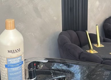 Modern wash basin with Mizani shampoo at Zoteya Beauty Salon, Sandton, Gauteng, ZA.