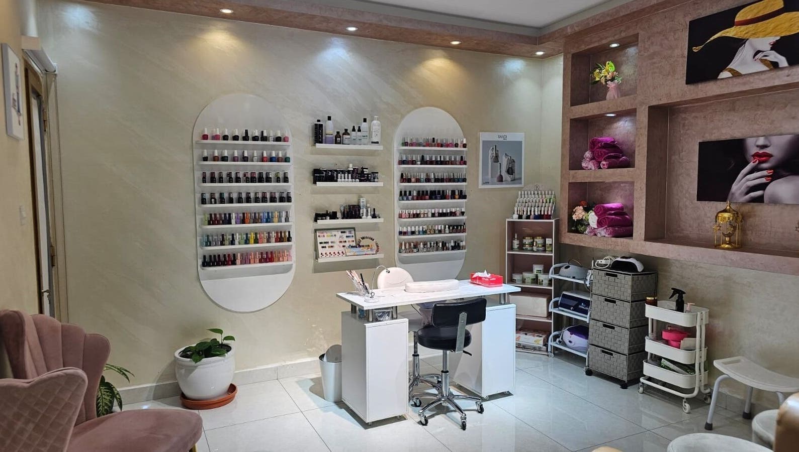 Manicure station at Bloomself Beauty Ladies Saloon in Abu Dhabi, AE, showcasing a range of nail polishes.