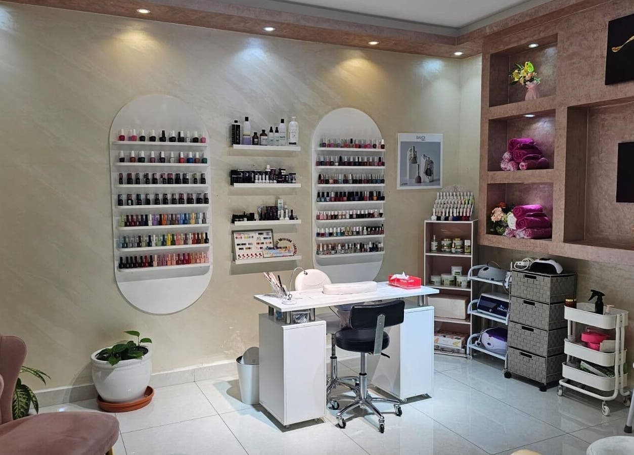 Manicure station at Bloomself Beauty Ladies Saloon in Abu Dhabi, AE, showcasing a range of nail polishes.