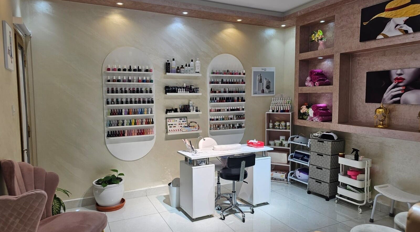Manicure station at Bloomself Beauty Ladies Saloon in Abu Dhabi, AE, showcasing a range of nail polishes.