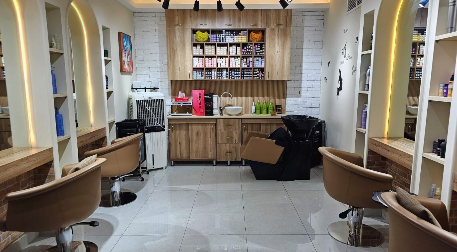 Stylish interior of Bloomself Beauty Ladies Saloon in Abu Dhabi, AE with modern furnishings and beauty products.