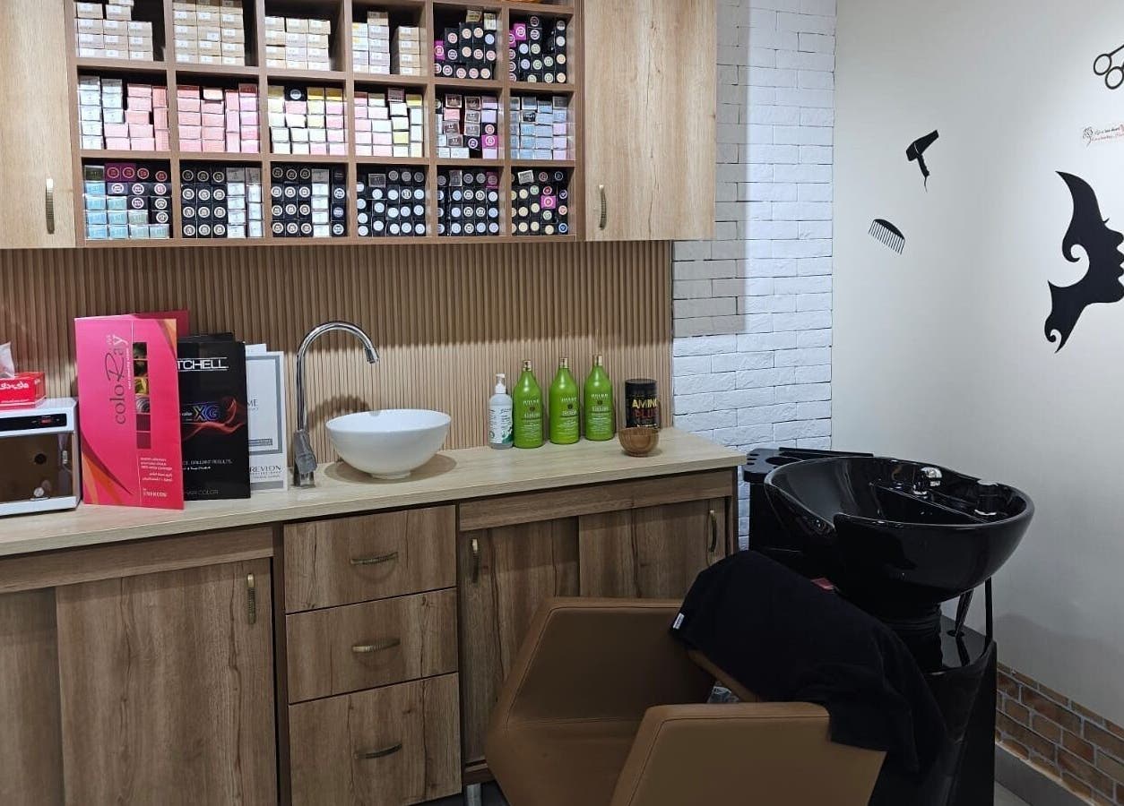 Hair station at Bloomself Beauty Ladies Saloon, Abu Dhabi, AE with modern sink and product shelves for treatments.