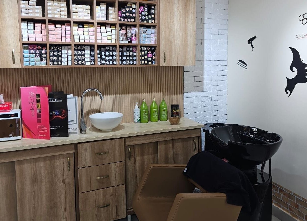 Hair station at Bloomself Beauty Ladies Saloon, Abu Dhabi, AE with modern sink and product shelves for treatments.