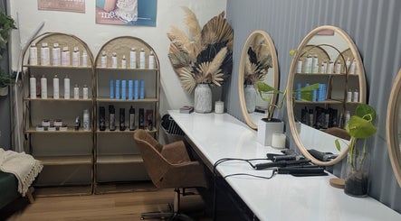 Stylish hair station at Sarah Jane Hair Craft, Melbourne, Victoria, AU, with mirrors and products.