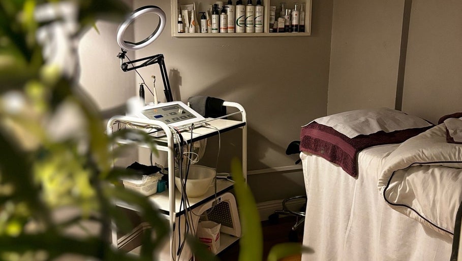 Cozy treatment room at Image Beauty Clinic, County Tipperary, IE, featuring a massage bed and skincare equipment.
