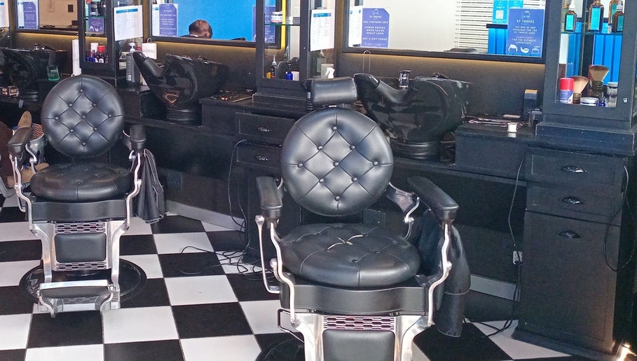 Elegant barber chairs at St Tropez Homme Barbershop, Cape Town, Western Cape, ZA.
