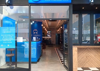Entrance of St Tropez Homme Barbershop, Cape Town, Western Cape, ZA, showcasing chic interior design.