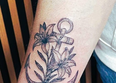 Anchor and floral tattoo at Indecisive Create in Auckland, Auckland, NZ offers unique artistic designs.