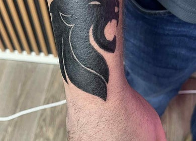 Bold lion tattoo on an arm at Indecisive Create, Auckland, Auckland, NZ.