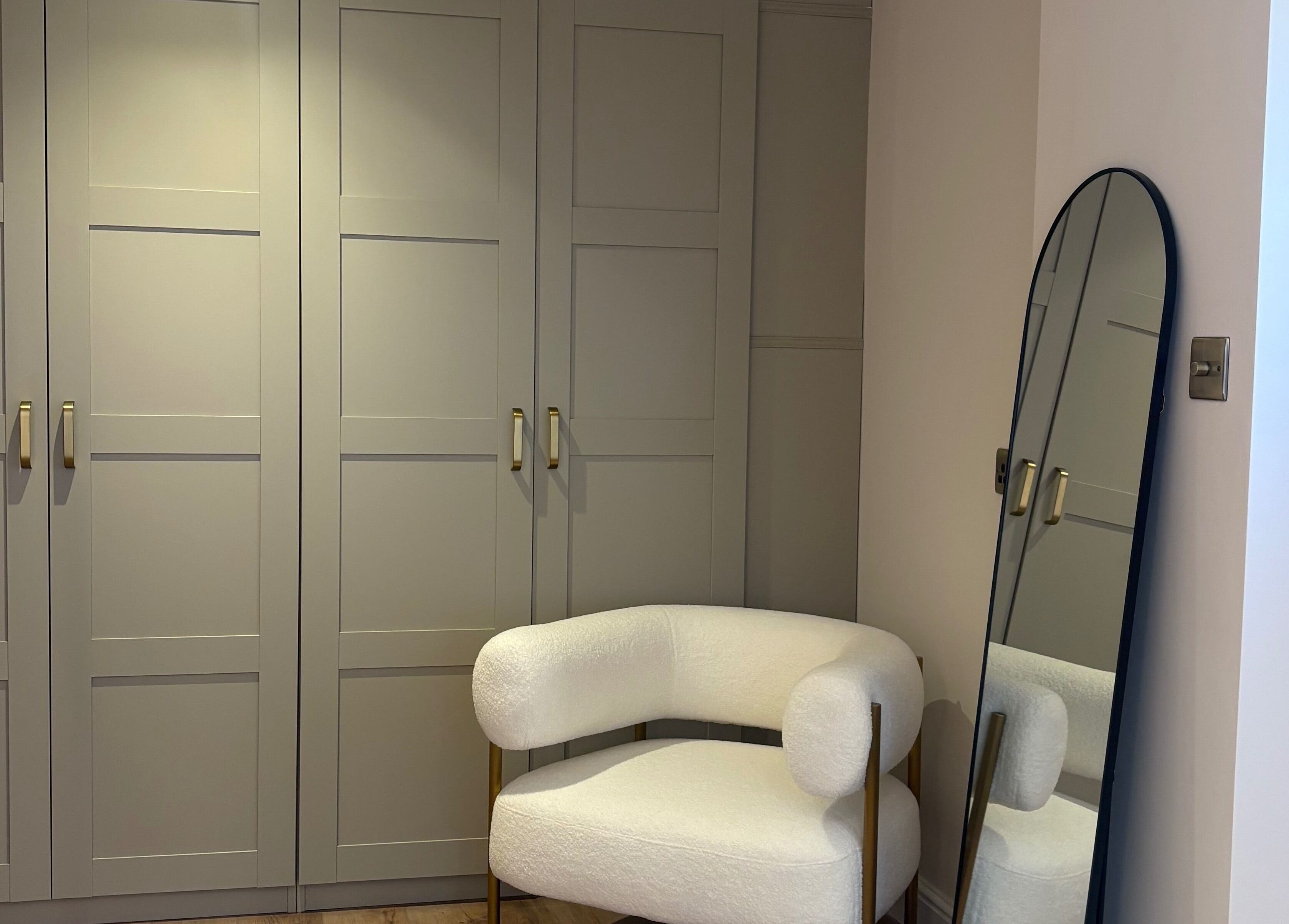 Elegant white chair and mirror at BareFacial, Thatcham, England, GB.