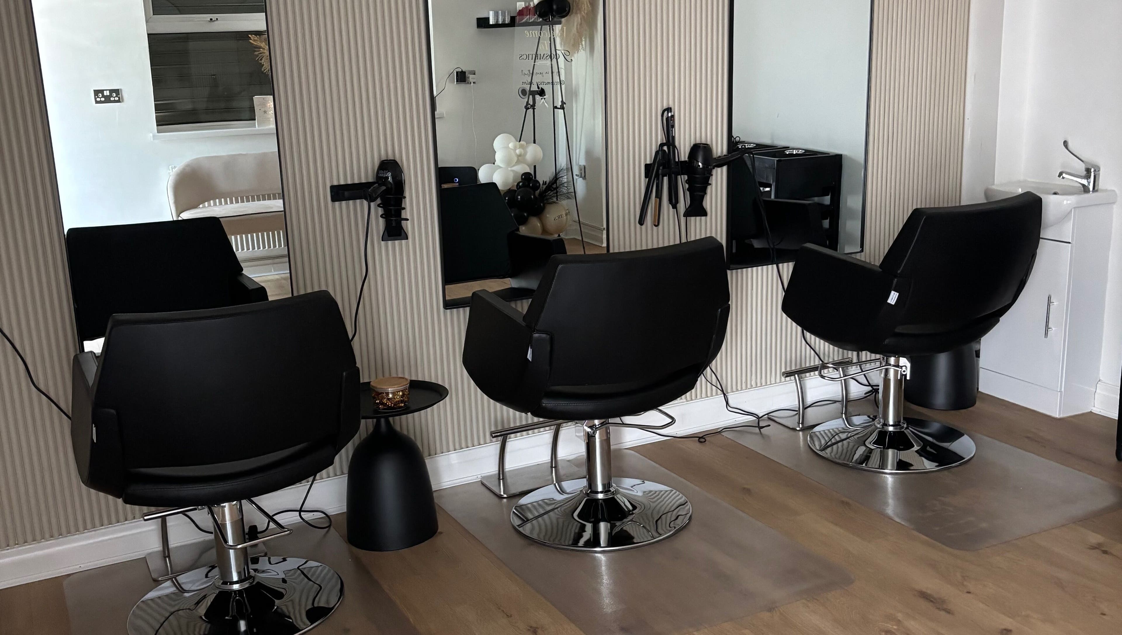 Modern salon chairs and mirrors at Tcosmetics in Swinton, England, GB offering premium beauty services.
